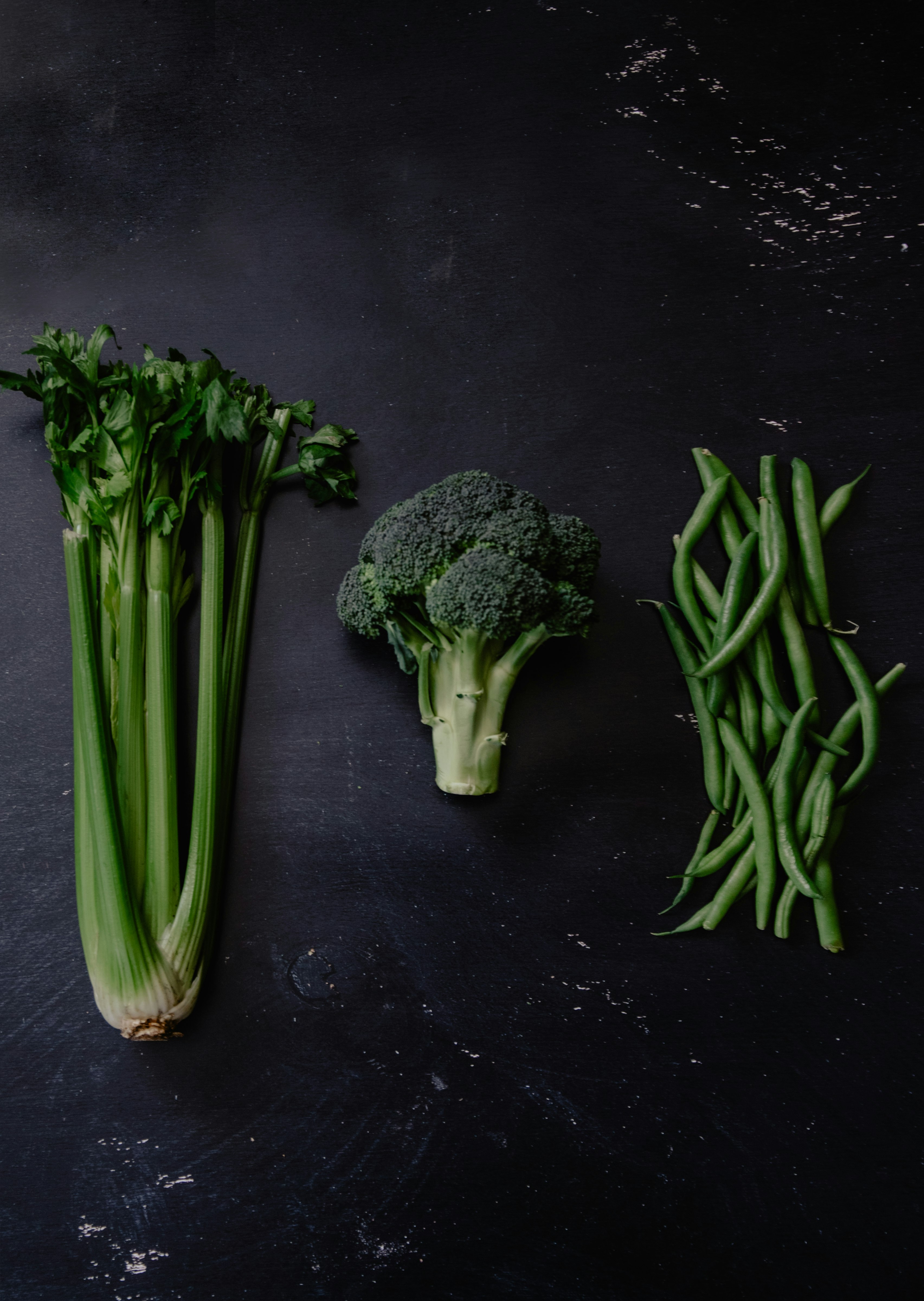 green vegetable on black table